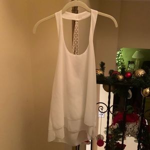 Pretty, flowy top with layered bottom. Sexy back.